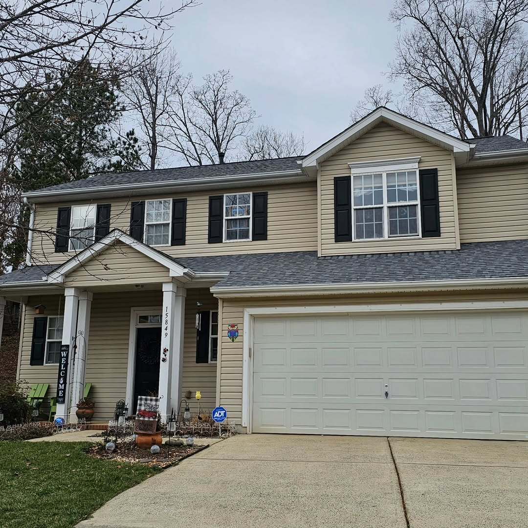 Two-story residence prepared for exterior renovation work